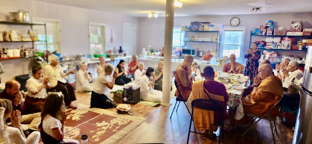 Everyone gathered together for a pre meal blessing offered by the Khmer sangha.