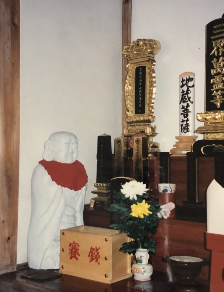 Photo of Jizo Statue inside a Japanese Temple. 