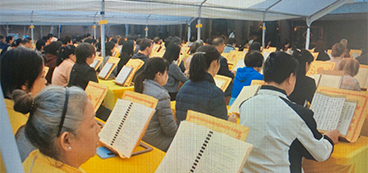 Participants at Holy Miracle's Dharma assembly in tents outside the temple. 