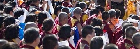 Followers kneel as H.H. Dorje Chang Buddha III enters to give a discourse and blessing to those who came to celebrate His birthday.