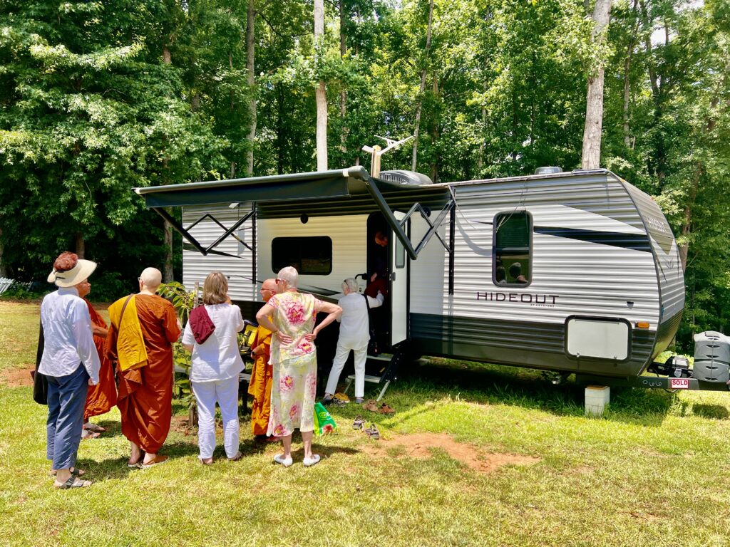 Ayya Saddha's new "kuti" (trailer) donated to her by the Cambodian Sangha. Heartwood sangha checking it out for the first time. (July 7 2024).